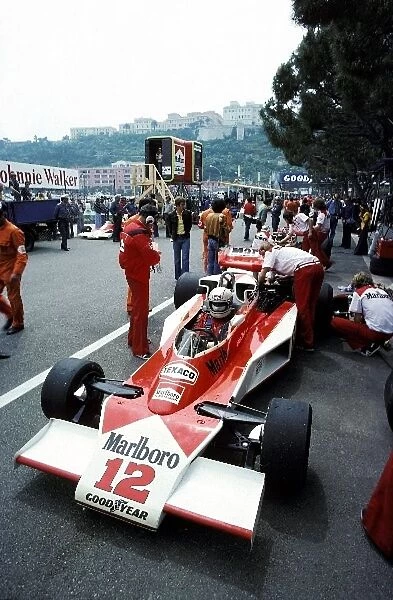 Formula One World Championship: Fifth placed Jochen Mass has his McLaren M23 prepared by the McLaren mechanics