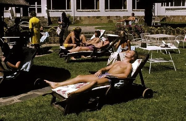 Formula One World Championship: Fifth placed Niki Lauda Ferrari works on his sun tan whilst relaxing at the Kyalami Ranch Hotel