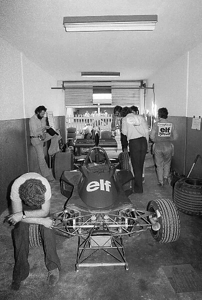 Formula One World Championship: Fifth placed Patrick Depailler walks from his Tyrrell 007 in the garage