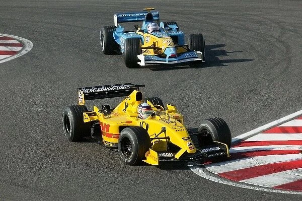 Formula One World Championship: Fifth placed Takuma Sato Jordan Honda EJ12 leads Jarno Trulli Renault R202