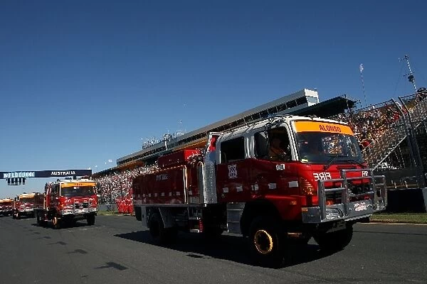 Formula One World Championship: Fire engine containing Fernando Alonso Renault during the drivers parade