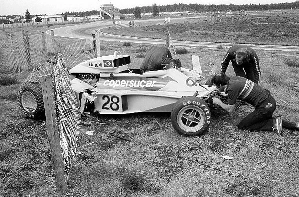 Formula One World Championship: Fittipaldi mechanics take a look at the damage of the new Copersucar-Fittipaldi F5 after Emerson Fittipaldi crashed