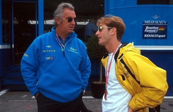 Formula One World Championship: Flavio Briatore Benetton Manager talks with his driver for the following season Jarno Trulli Jordan