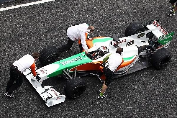 Formula One World Championship: Force India F1 Team mechanics come to the aid of Adrian Sutil Force India F1 VJM03, who has stopped at the end