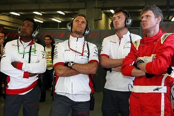 Formula One World Championship: Force India F1 Team mechanics watch qualifying