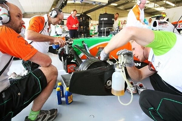 Formula One World Championship: Force India F1 VJM02 worked on in the pits