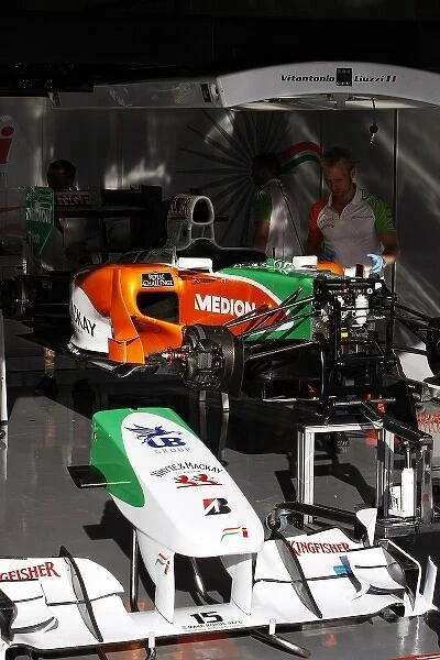 Formula One World Championship: Force India F1 VJM03 of Vitantonio Liuzzi Force India F1 worked on in the pits