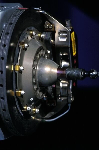 Formula One World Championship: A Formula One wheel hub showing brake disc and brake caliper
