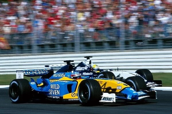 Formula One World Championship: Fourth placed Fernando Alonso Renault R23B passes Ralf Schumacher Williams BMW FW25, who crashed out on the opening