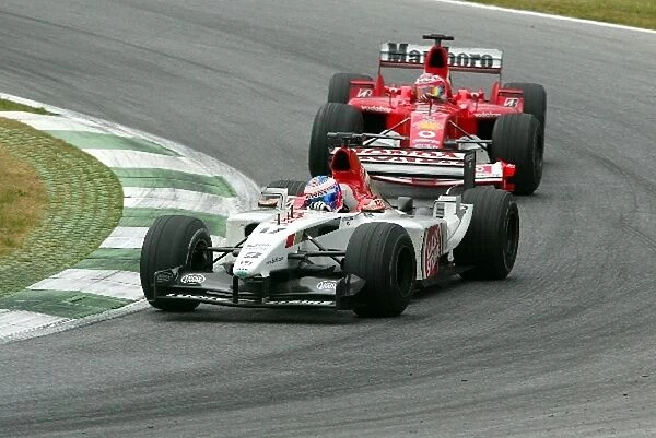 Formula One World Championship: Fourth placed Jenson Button BAR Honda 005 comes under pressure from Rubens Barrichello Ferrari F2003-GA, who