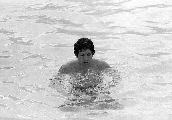 Formula One World Championship: Fourth placed Jody Scheckter Tyrrell, takes a breather after swimming at the pool whilst staying at the Kyalami