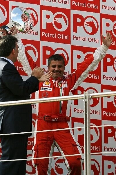 Formula One World Championship: Francesco Uguzzoni Ferrari Chief Mechanic received the Constructors Trophy on the podium