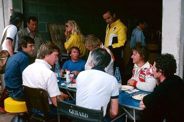 Formula One World Championship: The French drivers enjoy lunch together: Patrick Tambay McLaren; Didier Pironi Tyrrell; Jacques Laffite Ligier