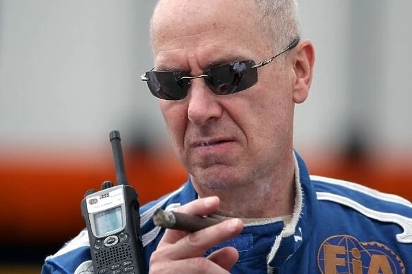Formula One World Championship: Gary Harstein FIA Doctor smokes a cigar