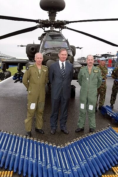 Formula One World Championship: Geoff Hoon Secretary of State for Defence with a British Army Agusta Westland Apache Helicopter on the start  /  finish