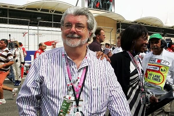 Formula One World Championship: George Lucas Film Director with partner Mellody Hobson President of Ariel Capital Management; Drector of Starbucks