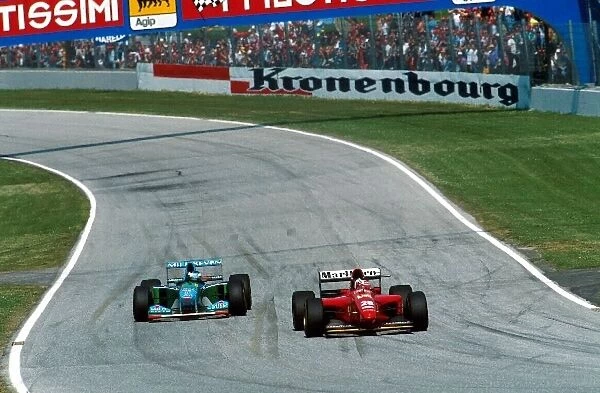 Formula One World Championship: Gerhard Berger Ferrari 412T1 leads eventual race winner Michael Schumacher Benetton B194