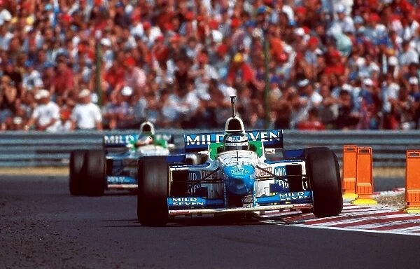 Formula One World Championship: Gerhard Berger Benetton B196 leads team mate Alesi only to have another engine failure