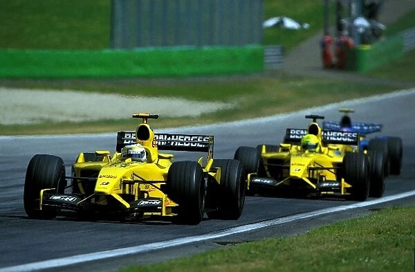 Formula One World Championship: Giancarlo Fisichella, Jordan Ford EJ13, is followed by team mate Ralph Firman. Fisichella retired on lap 60