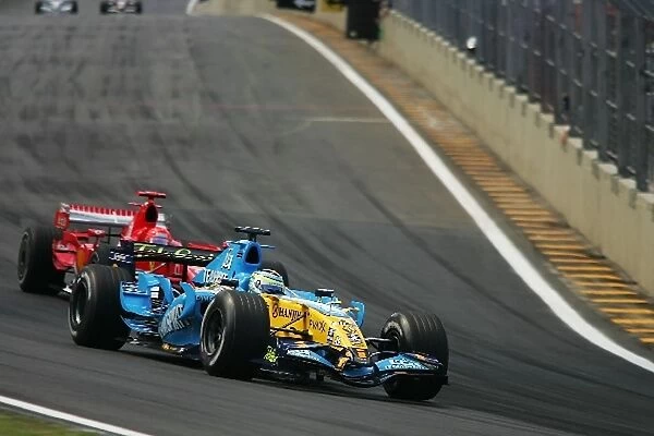 Formula One World Championship: Giancarlo Fisichella Renault R26 leads Michael Schumacher Ferrari 248 F1