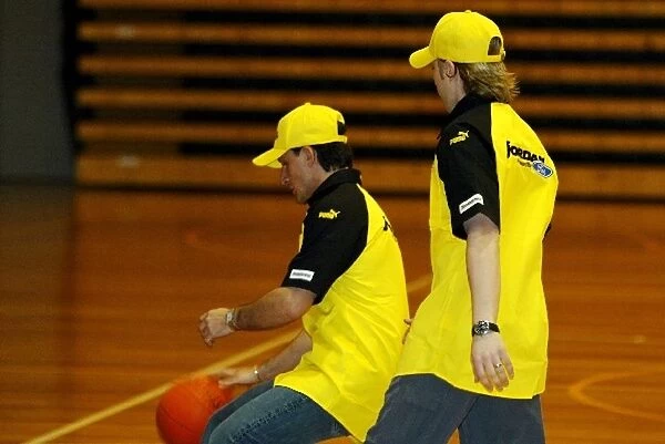 Formula One World Championship: Giorgio Pantano Jordan practices his basketball skills against team mate Nick Heidfeld Jordan
