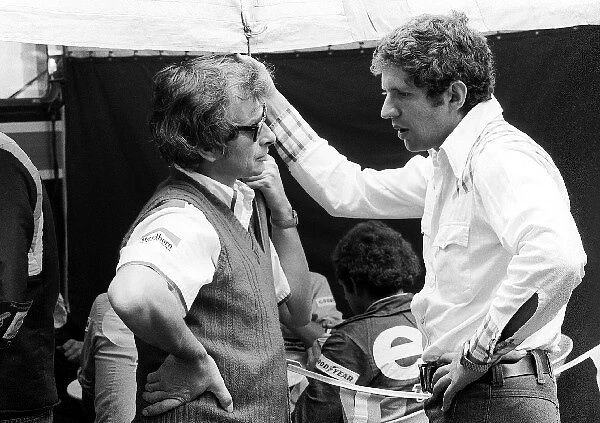 Formula One World Championship: Gordon Coppuck McLaren Designer talks with Jody Scheckter Tyrrell, who finished the race in fifth position