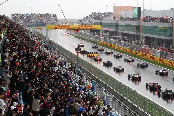 Formula One World Championship: The grid lines up behind the Safety Car for the re-start of the race