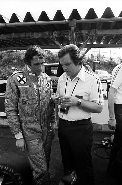 Formula One World Championship: Hans Binder Wolf Williams, who retired from the race on lap 50 with a wheel problem, talks with Patrick Head
