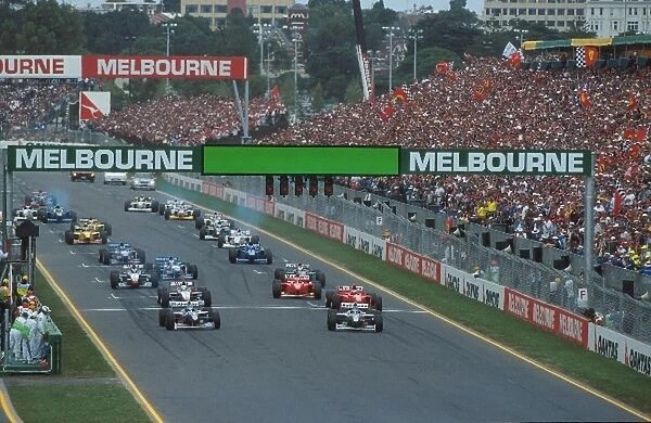 Formula One World Championship: Heinz-Harald Frentzen, Willams FW19 8th place, leads the field away at the start
