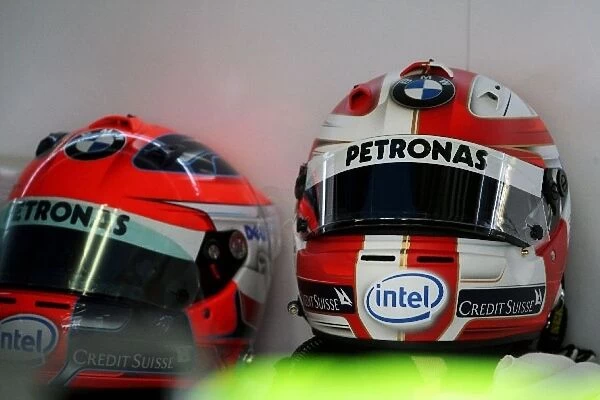 Formula One World Championship: The helmets of Robert Kubica BMW Sauber F1, new design on the right