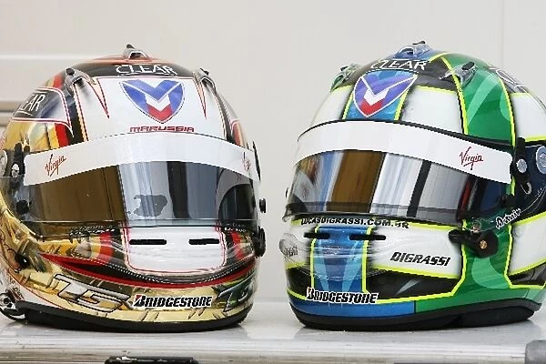 Formula One World Championship: The helmets of Timo Glock Virgin Racing and Lucas di Grassi Virgin Racing