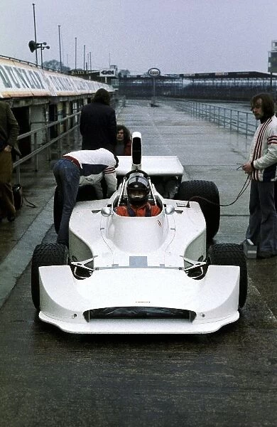 Formula One World Championship: The Hesketh 308C is tested by James Hunt at a wet Silverstone ahead of its debut at the non-championship Swiss