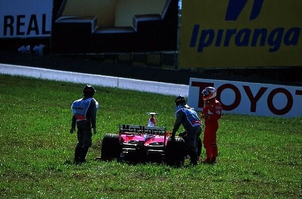 Formula One World Championship: Home town favourite Rubens Barrichello posts his eighth straight Brazilian Grand Prix retirement