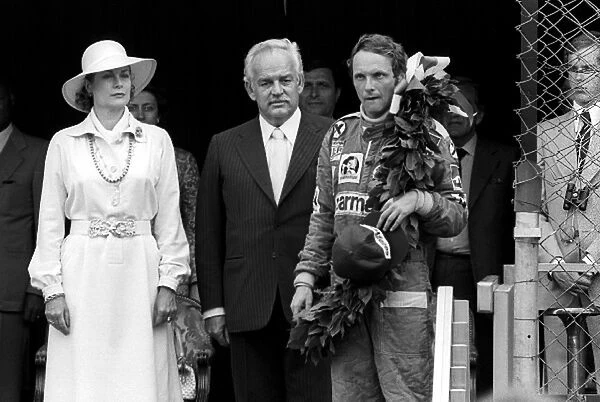 Formula One World Championship: HSH Princess Grace and HSH Prince Rainier with race winner Niki Lauda Ferrari, on the podium
