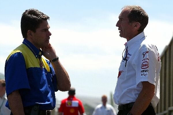 Formula One World Championship: Humphrey Corbett Toyota Race Engineer chats with a representative of Michelin