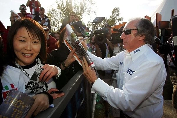Formula One World Championship: Jackie Stewart signs autographs for the fans