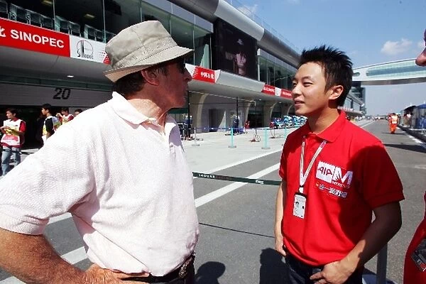 Formula One World Championship: Jackie Stewart talks with Marchy Lee Yin Kin