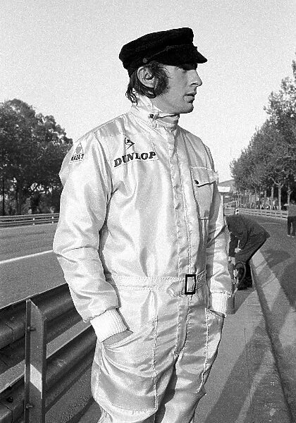 Formula One World Championship: Jackie Stewart winner in Matra MS80, shows off a natty line in head gear