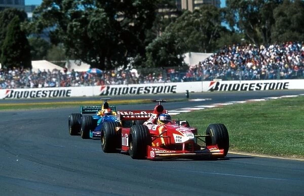 Formula One World Championship: Jacques Villeneuve Williams Mecachrome FW20 leads Johnny Herbert Sauber Petronas C17