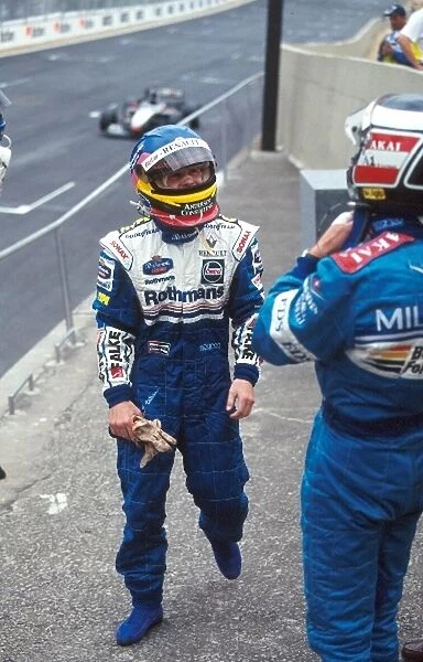 Formula One World Championship: Jacques Villeneuve Williams FW19, 1st place talks with Gerhard Berger Benetton B197 2nd place after a pleasing