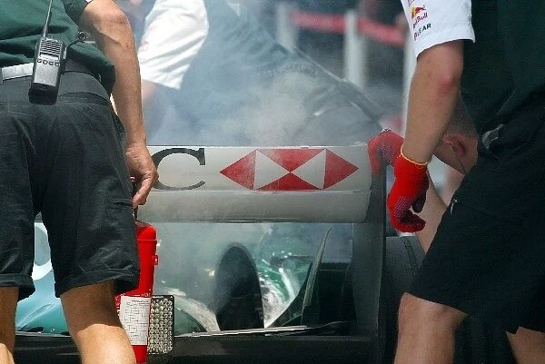 Formula One World Championship: The Jaguar of Bjorn Wirdheim Jaguar Cosworth R5 suffers a small exhaust fire in the pitlane