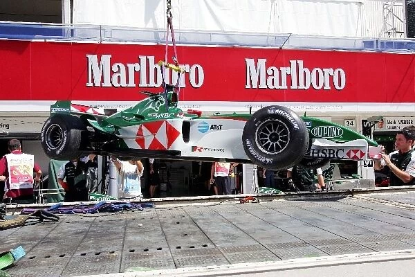 Formula One World Championship: The Jaguar R5 of Bjorn Wirdheim Jaguar Test Driver is recovered to the pits after a spin in first practice