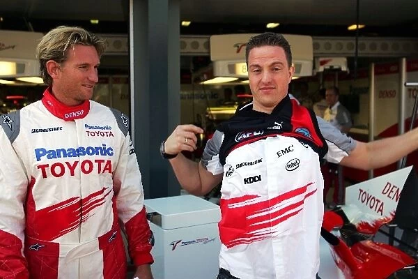 Formula One World Championship: James Hird Essendon Australian Rules Football Player exchanges shirts with Ralf Schumacher Toyota