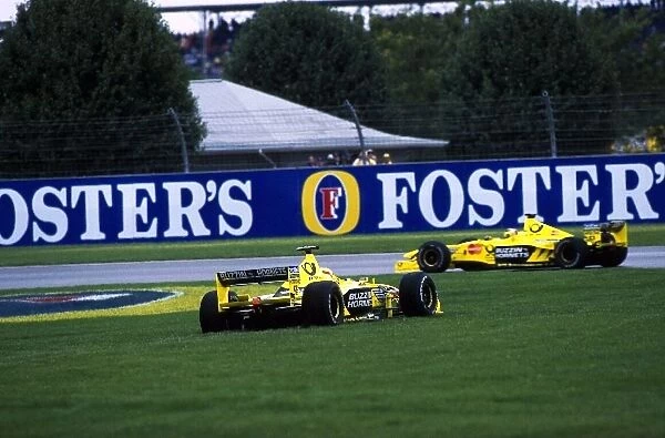 Formula One World Championship: Jarno Trulli Jordan Mugen Honda EJ10 spins on to the grass in front of team mate Frentzen who finished 3rd