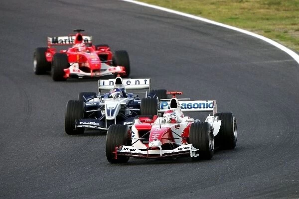 Formula One World Championship: Jarno Trulli Toyota TF104B leads Juan Pablo Montoya Williams BMW FW26