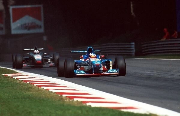 Formula One World Championship: Jean Alesi Benetton B197 leads David Coulthard Mclaren