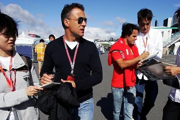 Formula One World Championship: Jean Alesi and Felipe Massa Ferrari sign autographs for the fans