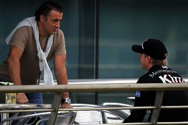 Formula One World Championship: Jean Alesi talks with Kimi Raikkonen McLaren