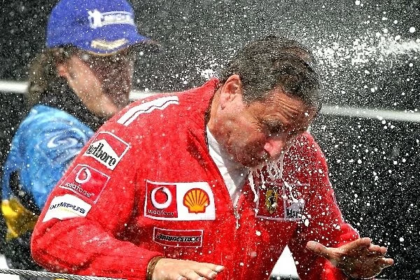 Formula One World Championship: Jean Todt Ferrari Sporting Director celebrates on the podium