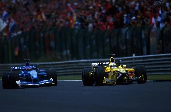Formula One World Championship: Jenson Button Benetton Renault B201, left, tries to overtake Jean Alesi Jordan Honda EJ11